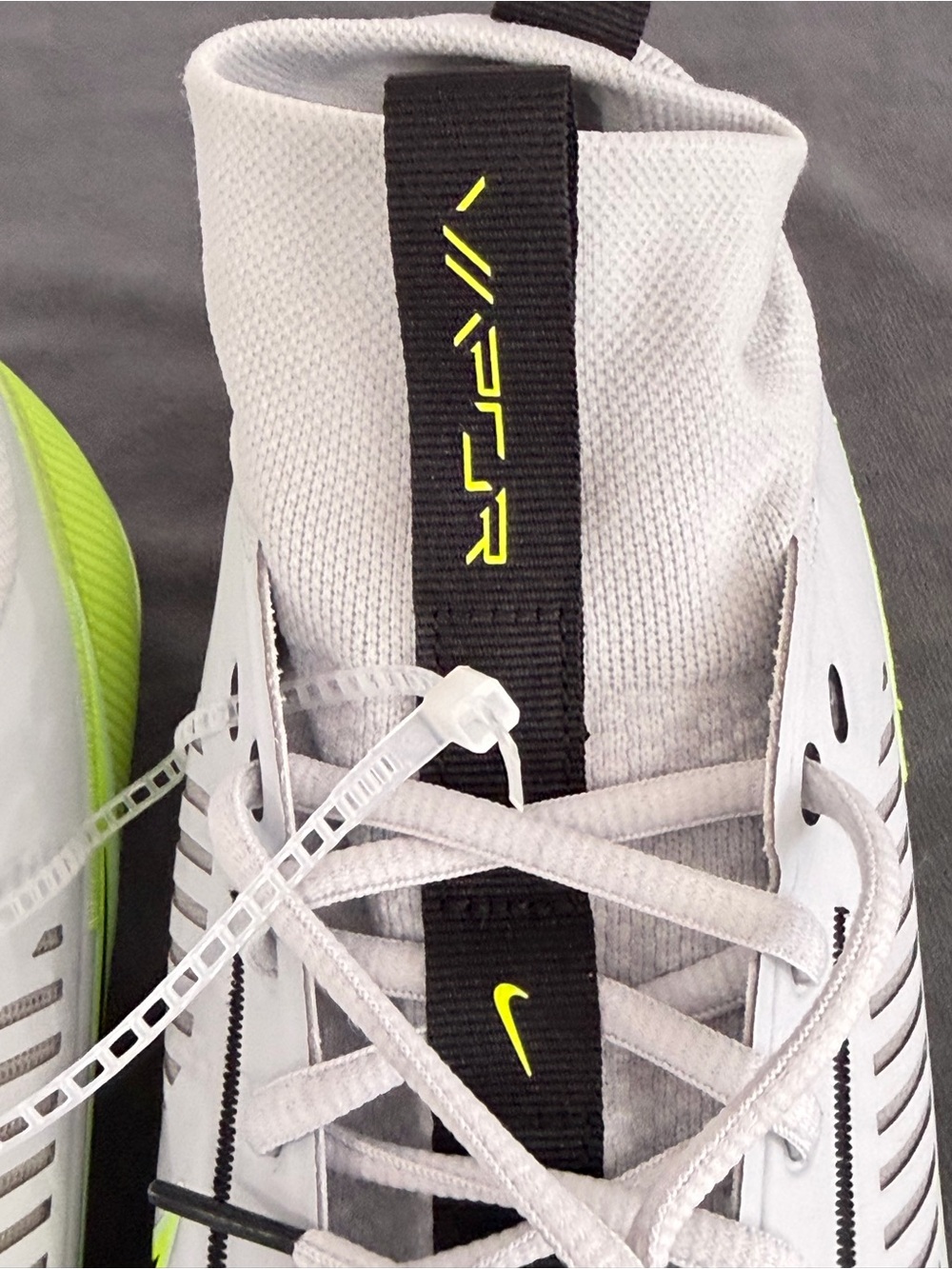 Nike Men’s White Athletic Cleats with Neon Yellow Accents - Picture 6 of 10